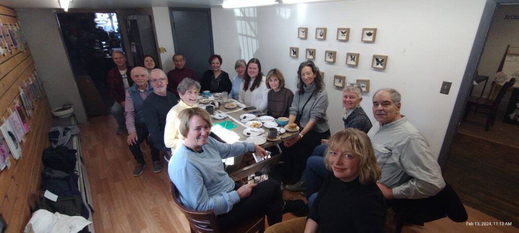 Participants at a Fort Collins French conversation meeting inside Bean Cycle Roasters